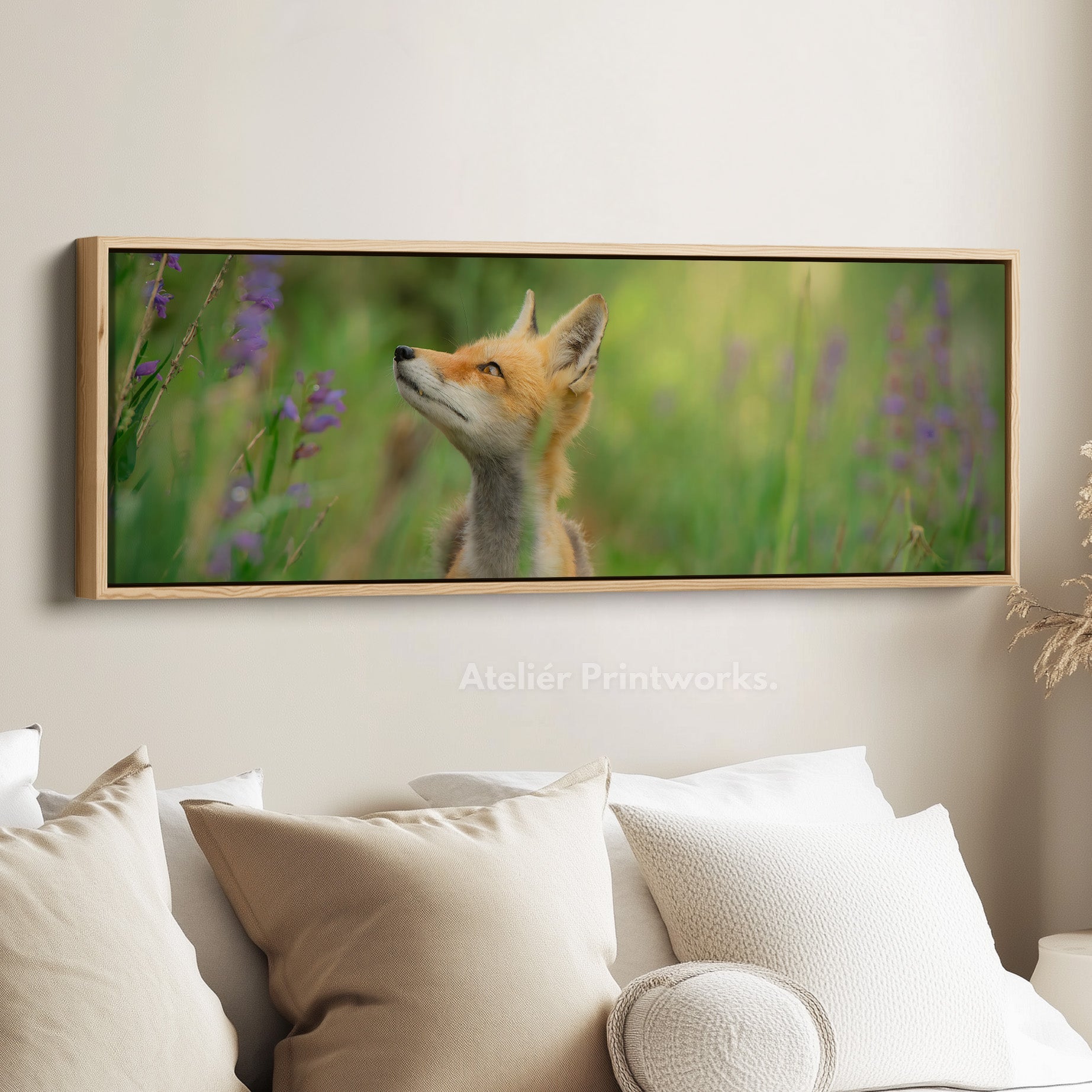 Above bed art fox in meadow looking upward among soft greenery for living room or bedroom